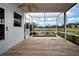 Screened patio with wood-like tile flooring at 1937 Sterling Glen Ct, Sun City Center, FL 33573