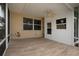 Covered patio with tile flooring and golf course view at 1937 Sterling Glen Ct, Sun City Center, FL 33573