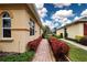 Brick walkway with manicured hedges leading to the house entrance at 1937 Sterling Glen Ct, Sun City Center, FL 33573