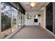 Sunroom boasting tile floors and sliding doors at 1937 Sterling Glen Ct, Sun City Center, FL 33573