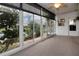 Sunroom with large windows and ceiling fan at 1937 Sterling Glen Ct, Sun City Center, FL 33573