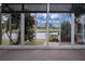 Bright sunroom with water views and tile flooring at 1937 Sterling Glen Ct, Sun City Center, FL 33573