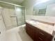 Bathroom with shower, granite countertop and vanity at 2284 Spanish Dr # 26, Clearwater, FL 33763