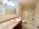 Bathroom with tub, shower, granite countertop and vanity at 2284 Spanish Dr # 26, Clearwater, FL 33763