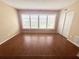 Bright bedroom with hardwood floors and large windows at 2284 Spanish Dr # 26, Clearwater, FL 33763