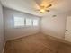 Simple bedroom with carpeted floor and ceiling fan at 2284 Spanish Dr # 26, Clearwater, FL 33763