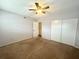 Simple bedroom with carpeted floor and ceiling fan at 2284 Spanish Dr # 26, Clearwater, FL 33763