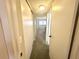 Bright hallway with carpet flooring and access to other rooms at 2284 Spanish Dr # 26, Clearwater, FL 33763