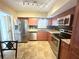 Kitchen with stainless steel appliances and wood cabinets at 2284 Spanish Dr # 26, Clearwater, FL 33763