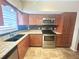 Modern kitchen featuring granite countertops and stainless steel appliances at 2284 Spanish Dr # 26, Clearwater, FL 33763