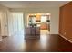 Living room with hardwood floors and view into kitchen at 2284 Spanish Dr # 26, Clearwater, FL 33763