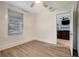 Simple bedroom with hardwood floors and view into living room at 2715 14Th N Ave, St Petersburg, FL 33713