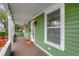 Inviting front porch with wooden flooring and white columns at 2715 14Th N Ave, St Petersburg, FL 33713