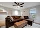 Cozy living room with a brown leather sectional and a ceiling fan at 2715 14Th N Ave, St Petersburg, FL 33713