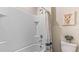 Bathroom with a shower/tub combo and a window at 2927 Gardiner Ln, Zephyrhills, FL 33541