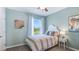 Bedroom with a twin bed and calming decor at 2927 Gardiner Ln, Zephyrhills, FL 33541