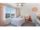 Bedroom with a twin bed and geometric wall art at 2927 Gardiner Ln, Zephyrhills, FL 33541