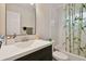 Full bathroom with tub shower and bamboo shower curtain at 2934 3Rd S Ave, St Petersburg, FL 33712