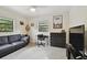 Bedroom with black leather couch, dresser, and home office at 2934 3Rd S Ave, St Petersburg, FL 33712