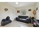 Bedroom with black leather couch, desk, and window view at 2934 3Rd S Ave, St Petersburg, FL 33712