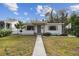 Cute bungalow style home with a landscaped lawn and walkway at 2934 3Rd S Ave, St Petersburg, FL 33712