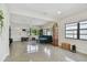 Bright living room featuring a comfy couch and polished concrete floors at 2934 3Rd S Ave, St Petersburg, FL 33712