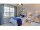 Guest bedroom with twin-sized bed, window with water view, and dresser at 2936 Gardiner Ln, Zephyrhills, FL 33541