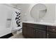 Modern bathroom with dark vanity and subway tile at 29913 Southwell Ln, Wesley Chapel, FL 33543