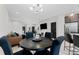 Bright dining area with a round wooden table and black chairs at 29913 Southwell Ln, Wesley Chapel, FL 33543