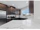 Modern kitchen features stainless steel appliances and quartz countertops at 29913 Southwell Ln, Wesley Chapel, FL 33543