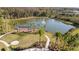 Community lake with fountain and recreational area at 29913 Southwell Ln, Wesley Chapel, FL 33543