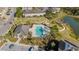 Community pool and clubhouse with surrounding landscape at 29913 Southwell Ln, Wesley Chapel, FL 33543