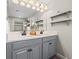 Modern bathroom with double vanity and gray cabinets at 3421 Janna Grace Way, Land O Lakes, FL 34638