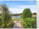 Pond view from backyard with brick walkway at 3421 Janna Grace Way, Land O Lakes, FL 34638