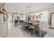 Bright dining room with farmhouse table and chandelier at 3421 Janna Grace Way, Land O Lakes, FL 34638