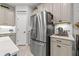 Stainless steel refrigerator in kitchen with pantry at 3421 Janna Grace Way, Land O Lakes, FL 34638