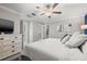 Main bedroom with large bed, dresser, and en-suite bathroom at 3421 Janna Grace Way, Land O Lakes, FL 34638