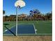 Community basketball court with playground in background at 34219 Sorrel Mint Dr, Wesley Chapel, FL 33543