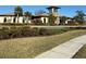 Community clubhouse with attractive landscaping at 34219 Sorrel Mint Dr, Wesley Chapel, FL 33543