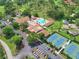 Aerial view of Highland Lakes community amenities, including pool and tennis courts at 3584 Oak Lake Dr, Palm Harbor, FL 34684