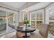 Bright breakfast nook with window seating and a round table at 3584 Oak Lake Dr, Palm Harbor, FL 34684