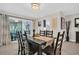 Bright dining room with a dark wood table and seating for six at 3584 Oak Lake Dr, Palm Harbor, FL 34684