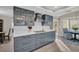 Modern gray kitchen with white subway tile backsplash at 3584 Oak Lake Dr, Palm Harbor, FL 34684