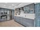 Stylish kitchen featuring gray cabinets, white subway tile, and stainless steel appliances at 3584 Oak Lake Dr, Palm Harbor, FL 34684