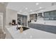 Modern kitchen with gray cabinets, white countertops, and stainless steel appliances at 3584 Oak Lake Dr, Palm Harbor, FL 34684