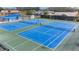 Two well-maintained tennis courts at 3584 Oak Lake Dr, Palm Harbor, FL 34684