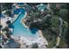 Large resort-style pool with waterslides and plenty of lounge chairs at 36750 Us Highway 19 N # 04221, Palm Harbor, FL 34684