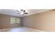 Large bedroom with ceiling fan and large window at 36750 Us Highway 19 N # 04221, Palm Harbor, FL 34684