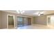 Living room with tile floors and access to a private balcony at 36750 Us Highway 19 N # 04221, Palm Harbor, FL 34684