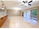 Spacious living room with tile flooring and access to balcony at 36750 Us Highway 19 N # 04221, Palm Harbor, FL 34684